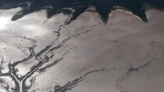 Photo of mud flats revealed when the tide recedes at Derby in Western Australia.