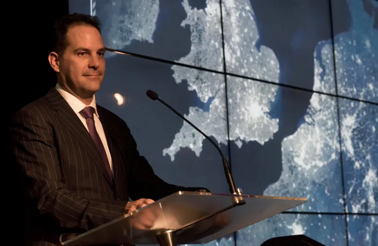 Man stands at podium